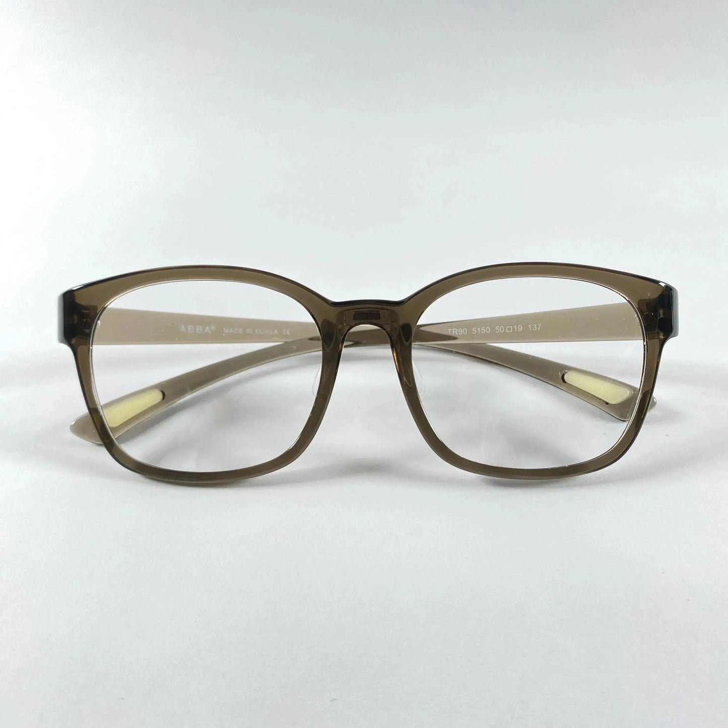 Front view of olive green square eyeglass frames on white background
