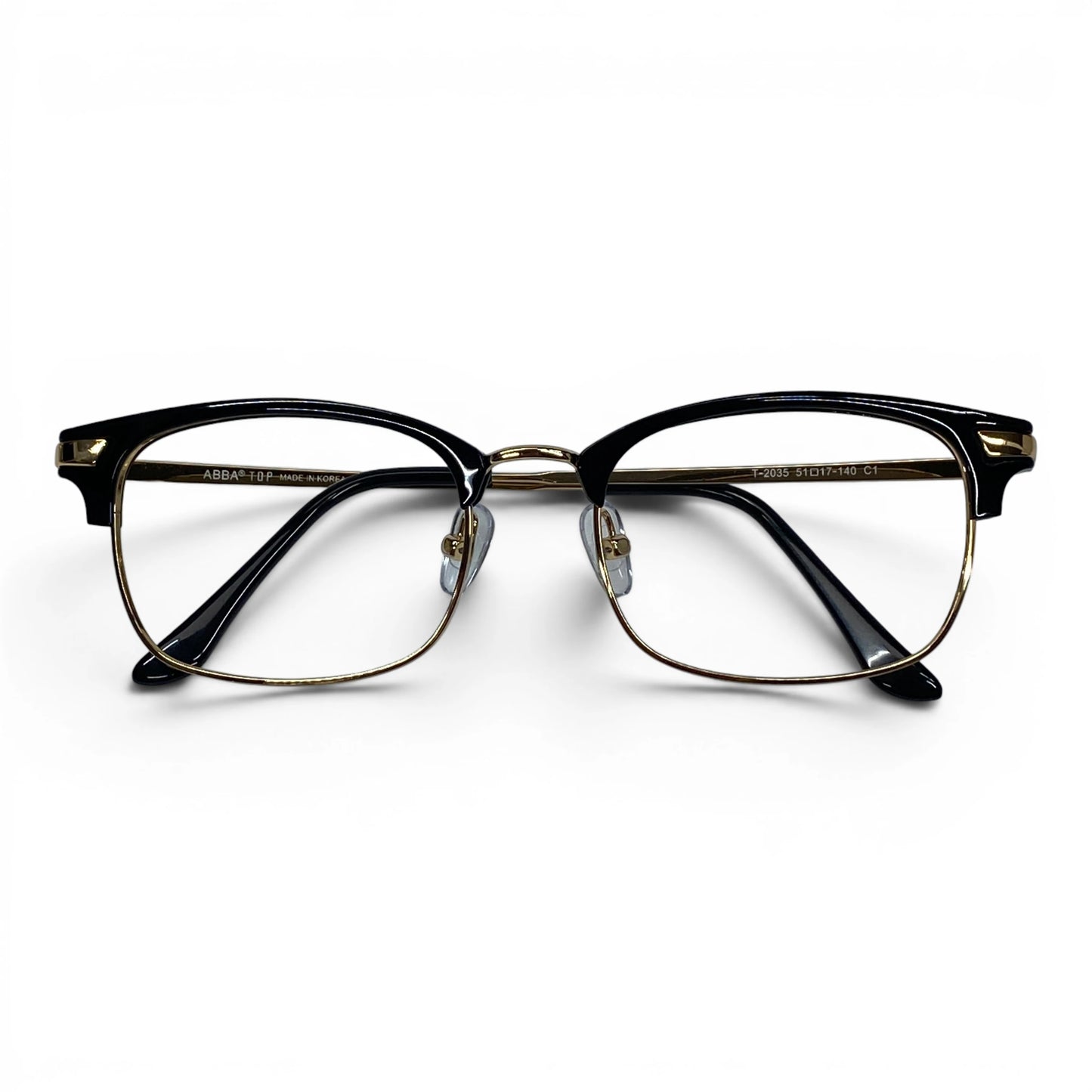 ClubVion 2035 detail view - premium gold metal bridge and lower rim contrasting with bold black upper frame