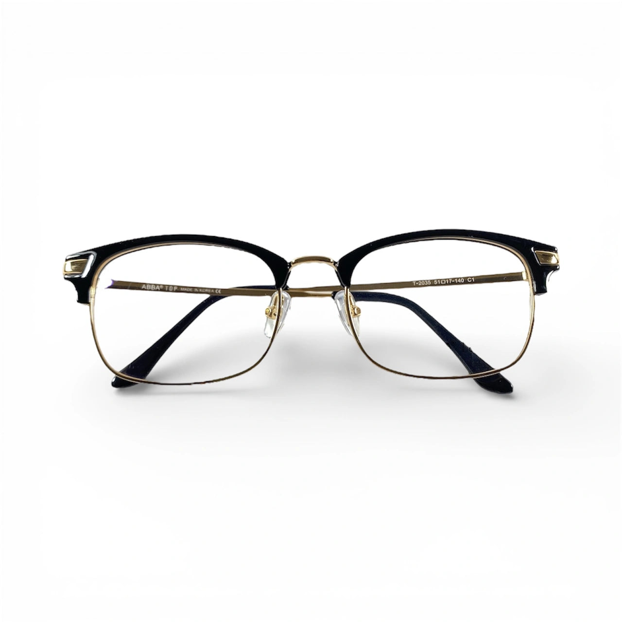 ClubVion 2035 detail view - premium gold metal bridge and lower rim contrasting with bold black upper frame