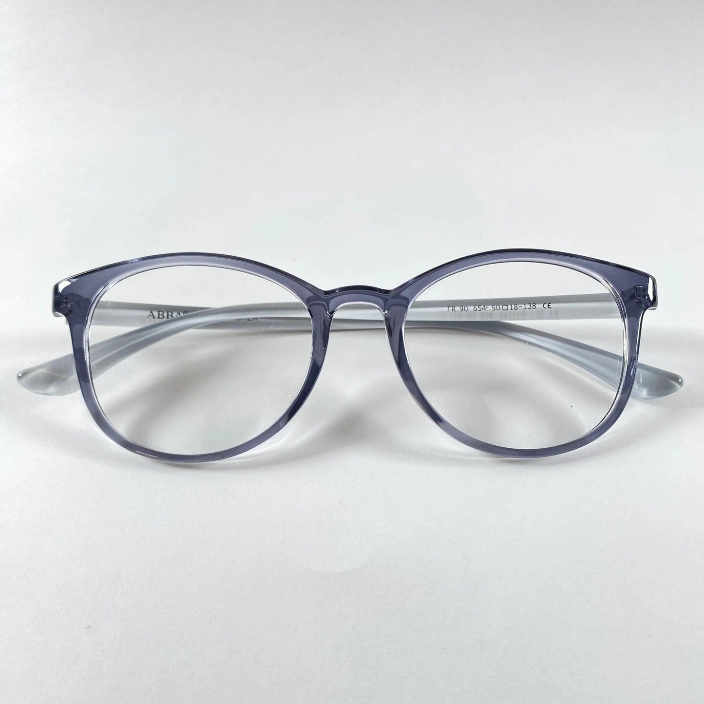 Round navy transparent eyeglasses on white background