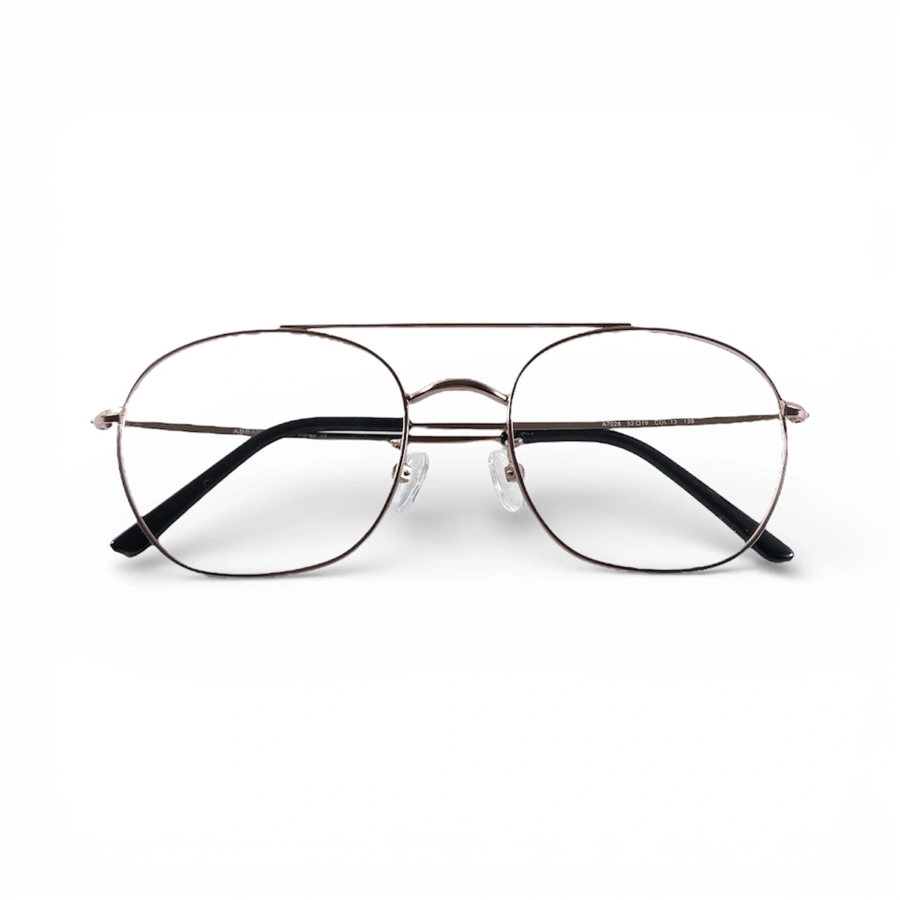 Rose gold pilot eyeglasses with thin metal frame and clear lenses on white background
