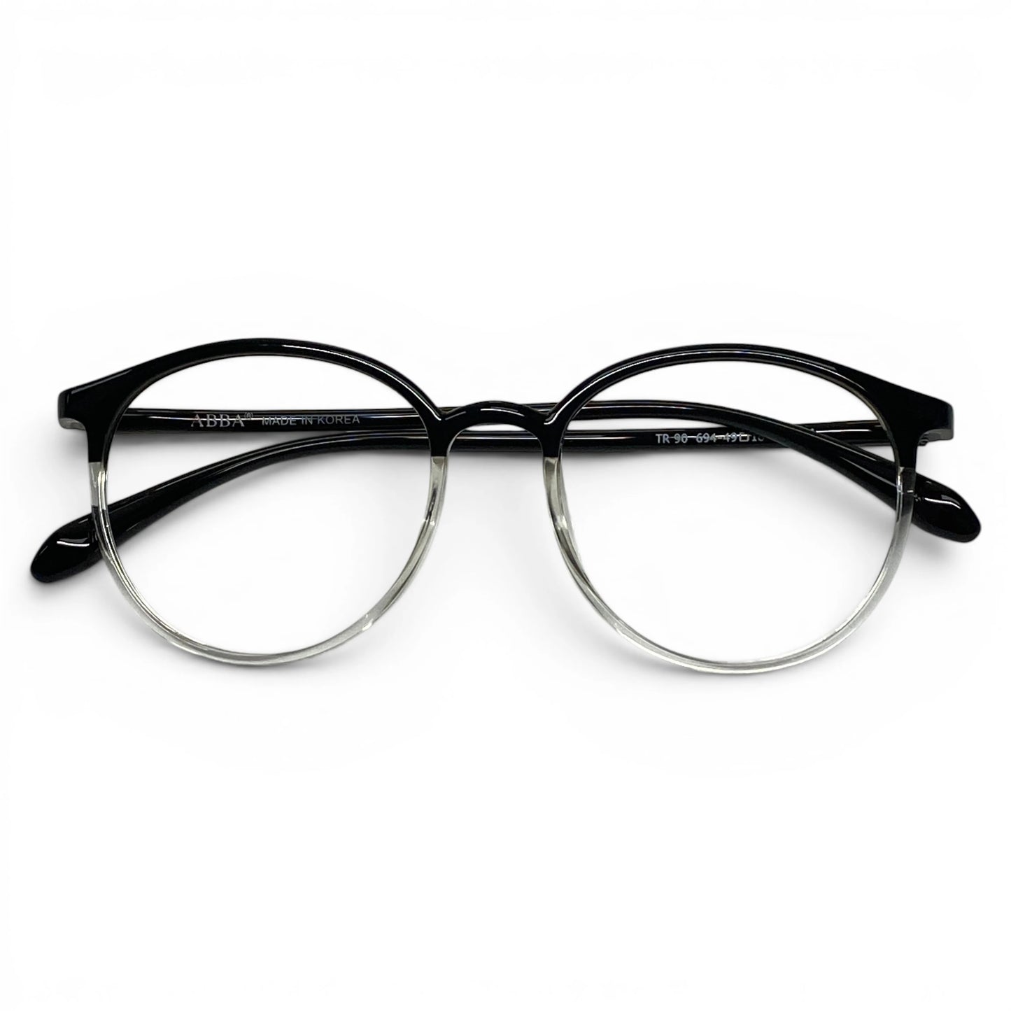 Round black clear plastic eyeglasses with transparent lower rims on white background