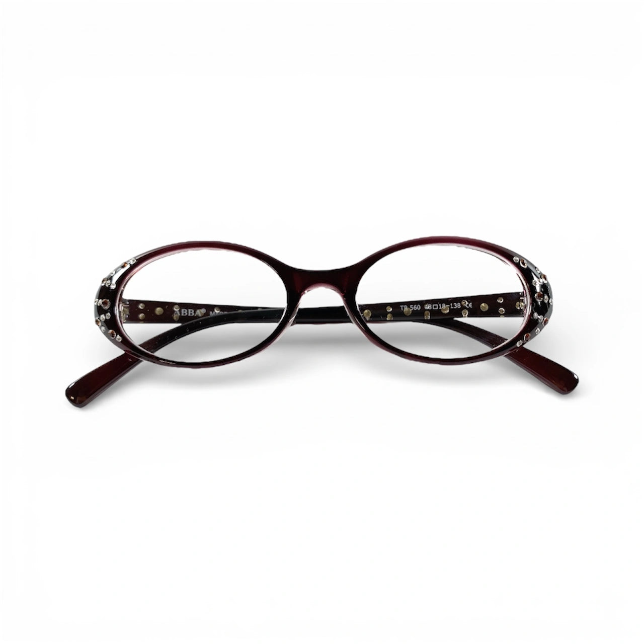 Oval burgundy glasses with crystal embellishments on the temples, product on white background