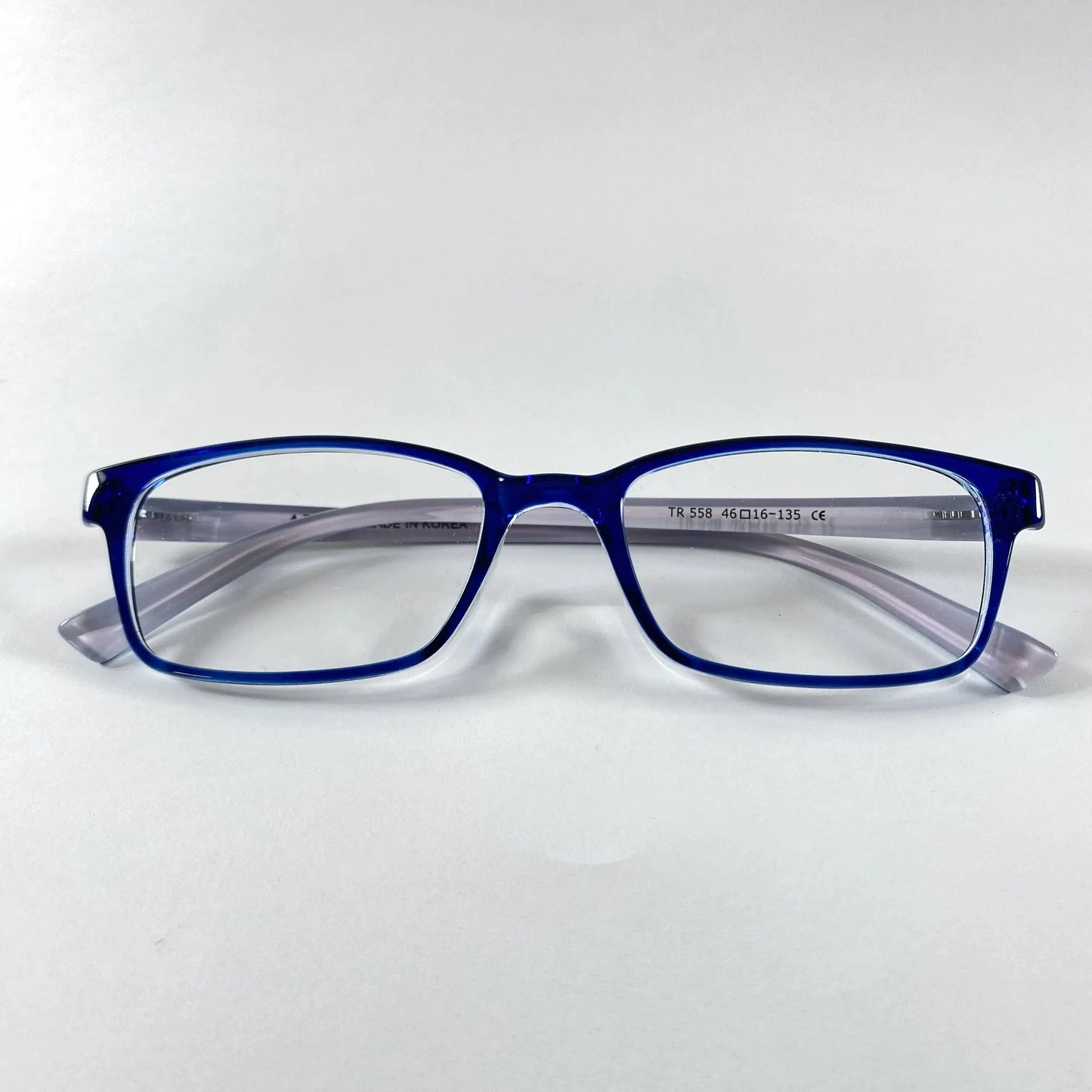 Blue rectangular kids eyeglasses with clear lenses on white background