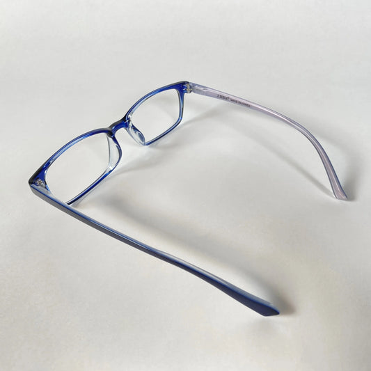 Blue kids eyeglasses with clear frames on white background, side view