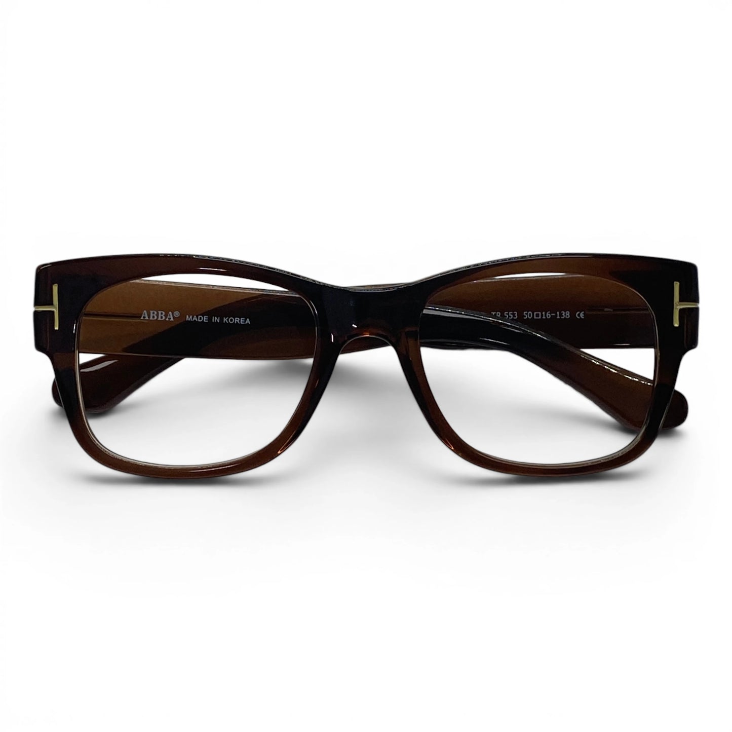 Brown gold detail rectangular eyeglass frame with clear lenses on white background