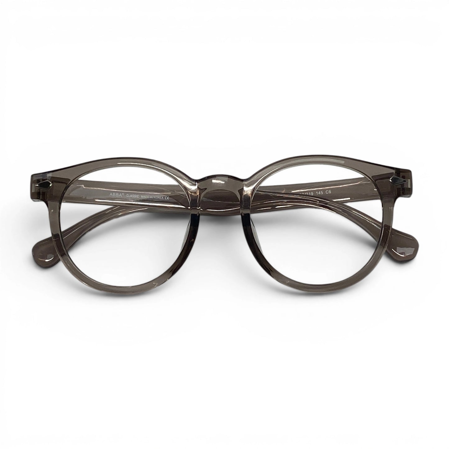 Round grey transparent eyeglasses with clear lenses on white background