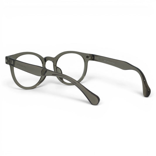 Round grey transparent eyeglasses with thick frames on a white background