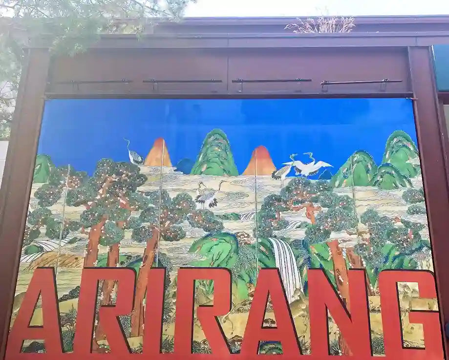 Arirang 102 Round Titanium Glasses inspired by Korean Arirang - traditional landscape mural with red Arirang lettering