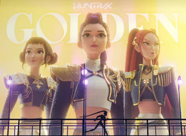 Huntrix from K-Pop Demon Hunters(KPDH) with ‘Golden’ lettering emphasizing the film’s iconic theme.