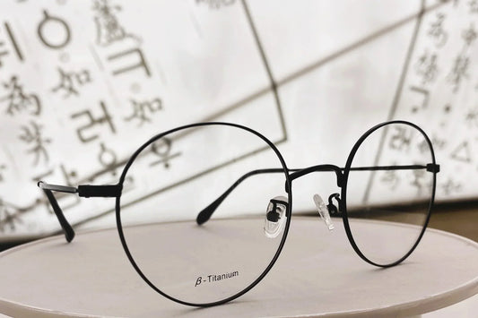 Beta titanium round glasses frame in black, showing premium quality Korean prescription glasses