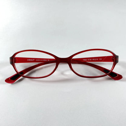 Red oval eyeglasses with sporty frame design on white background