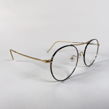 Gold round eyeglasses with thin metal frames on white background