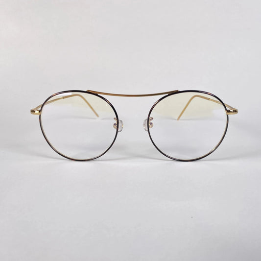 Gold round eyeglasses with clear lenses and thin metal frame on white background
