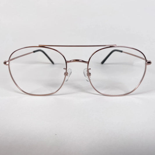 Rose gold pilot eyeglasses with thin metal frame on white background