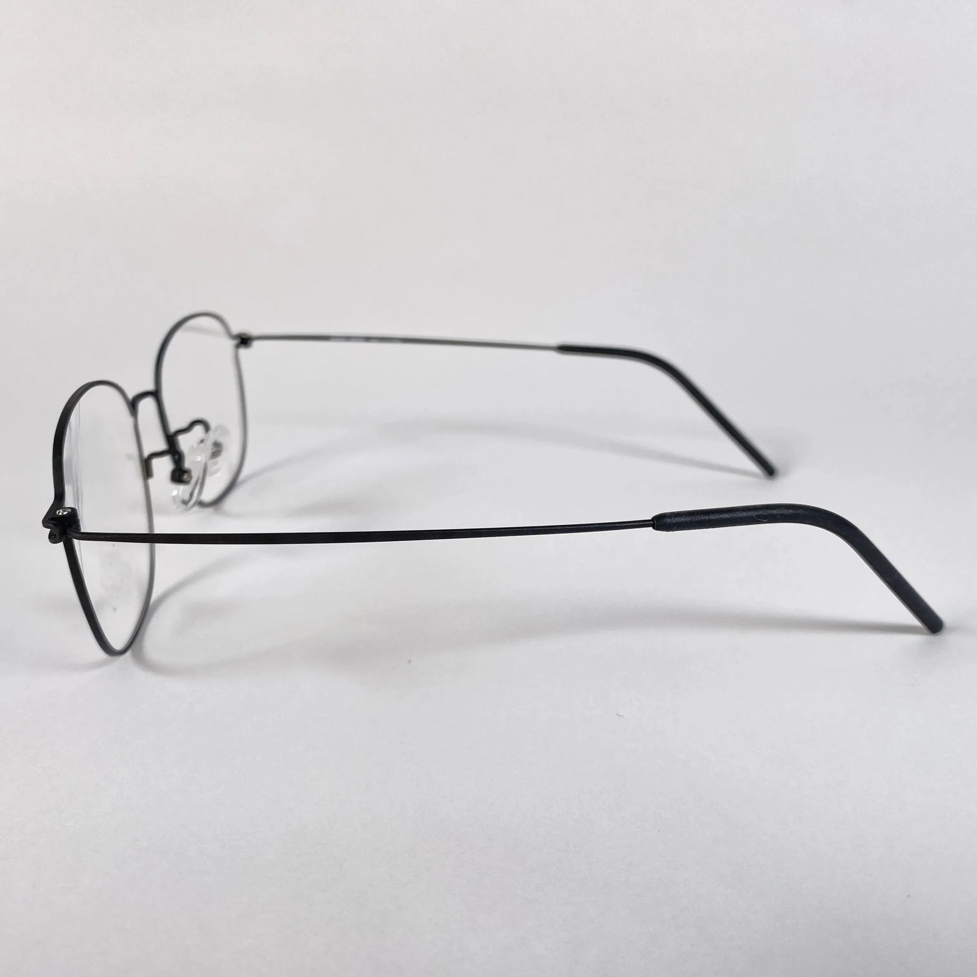 Round titanium eyeglasses with thin black metal frame on white background