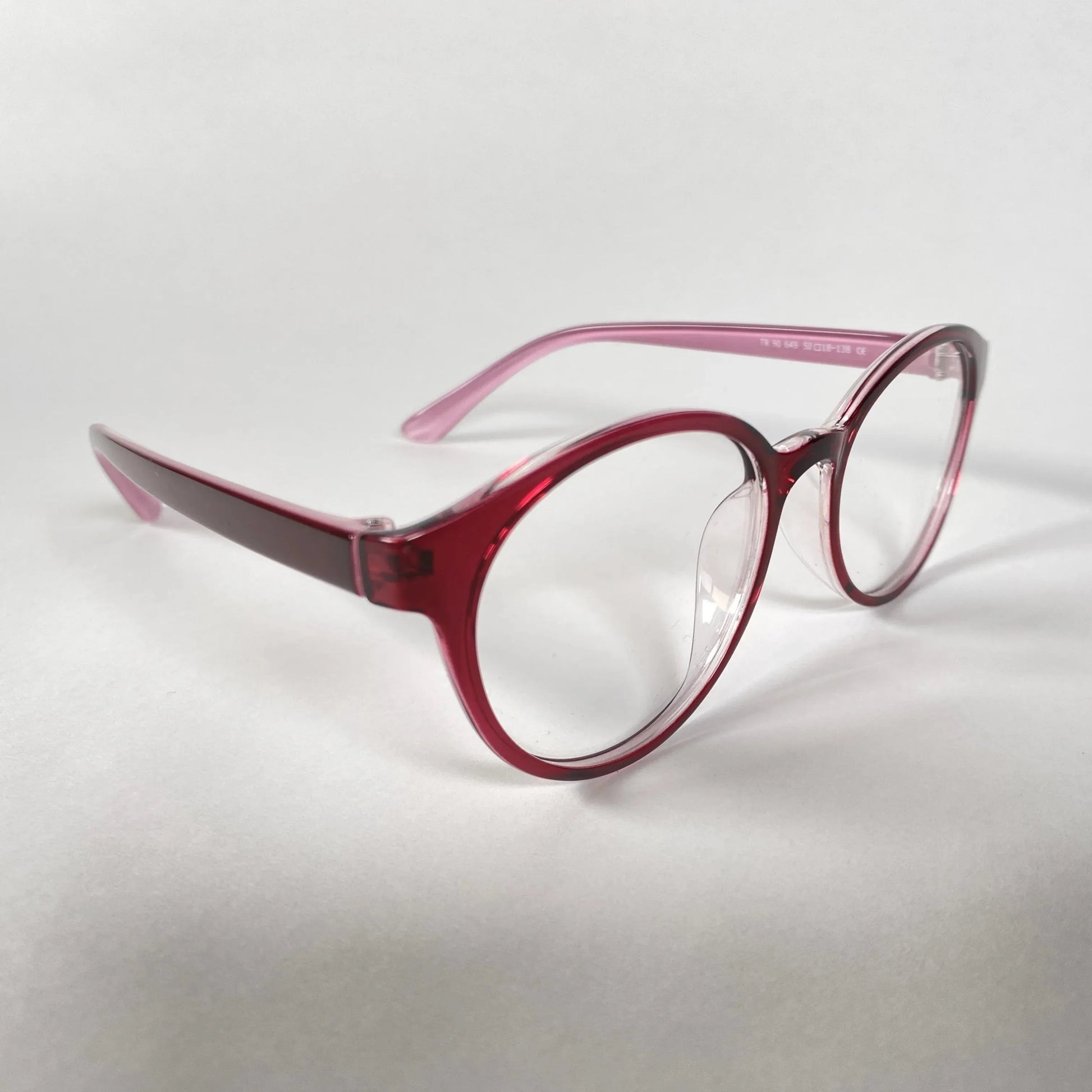 Round burgundy eyeglasses with clear lenses on a white background