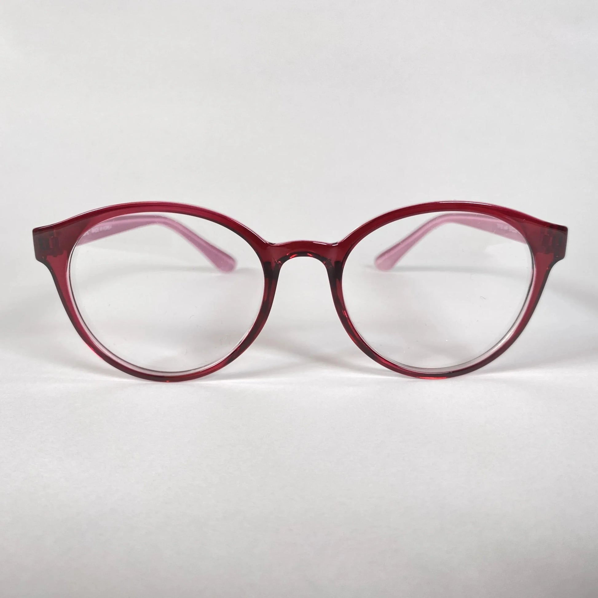 Round burgundy eyeglasses with clear lenses on a white background