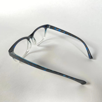 Blue marble-patterned eyeglasses frame side view on white background
