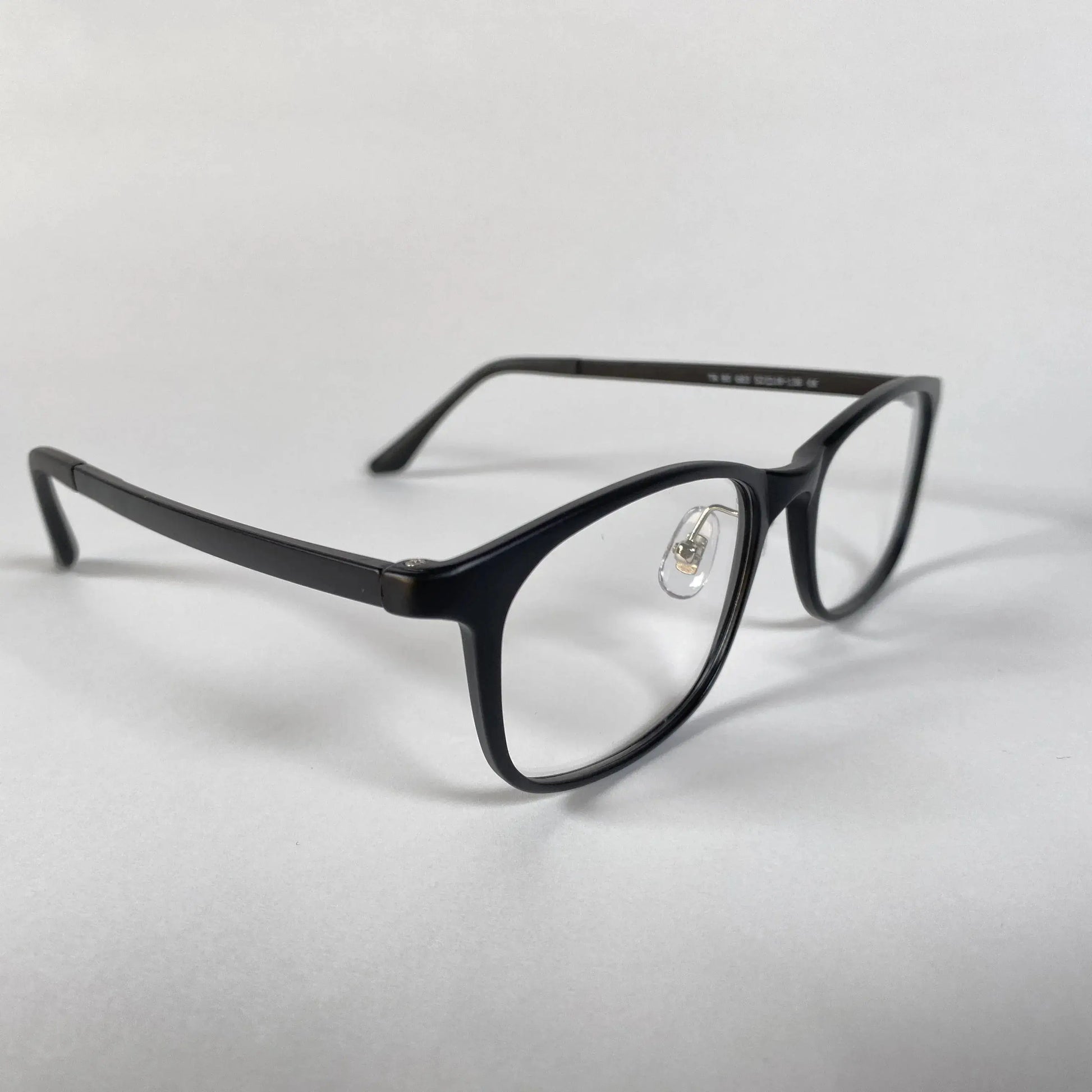 Black square eyeglasses with clear lenses and nose pads on a white background