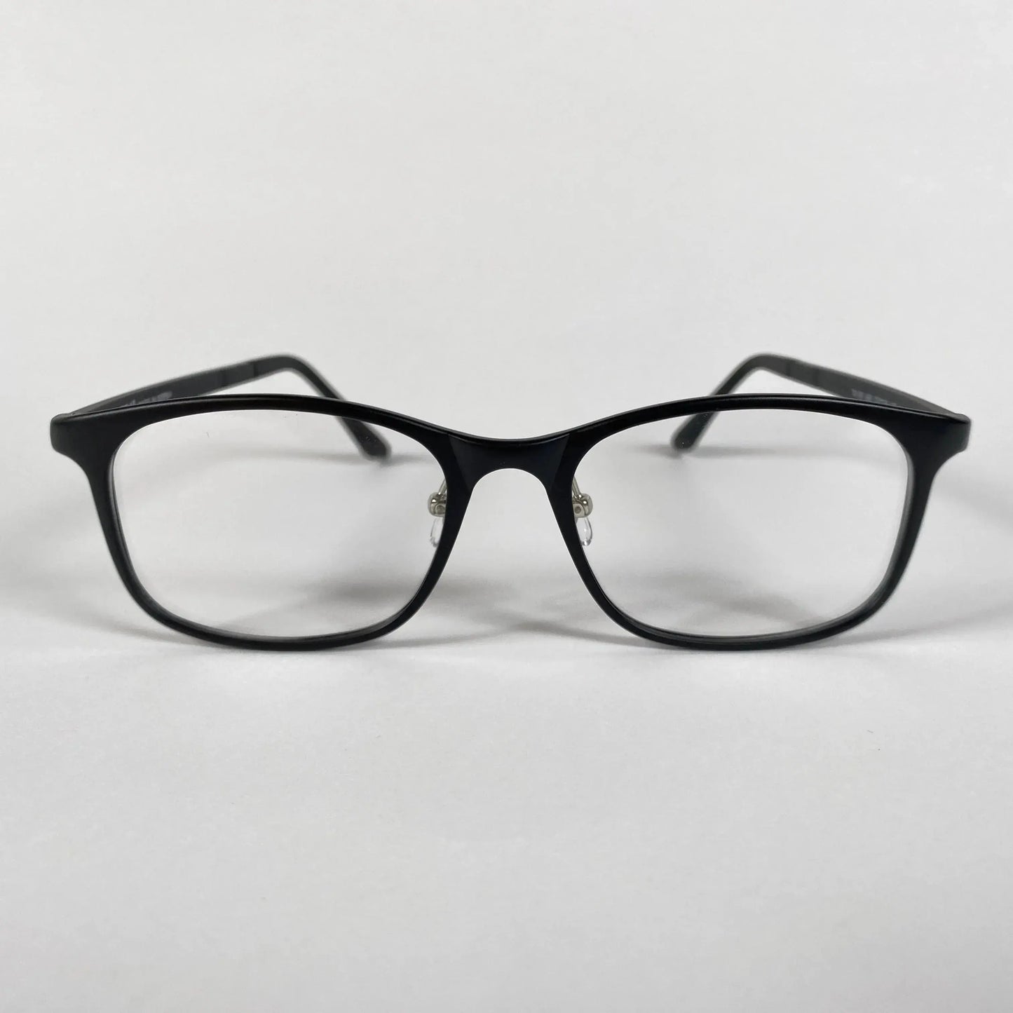 Black square eyeglasses with clear lenses on white background