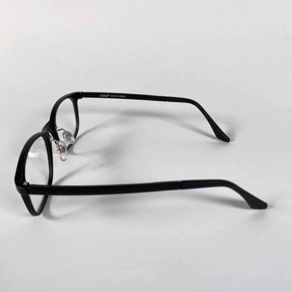 Black square eyeglasses frame side view on white background