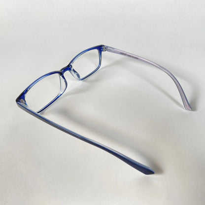 Blue kids eyeglasses with clear frames on white background, side view