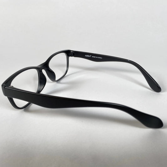 Black kids eyeglasses with ABBA branding, side view on white background.