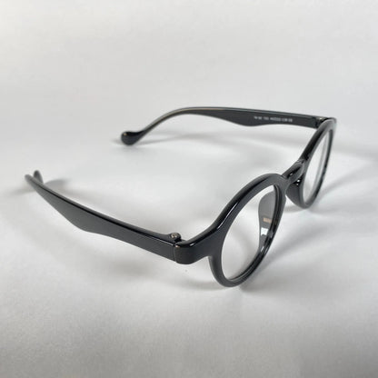 Round black metal eyeglasses with clear lenses on a white background