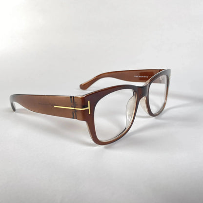 Brown acetate eyeglasses with gold T-shaped temple detail on a white background
