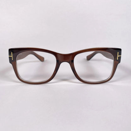 Brown square eyeglasses with gold accents on white background