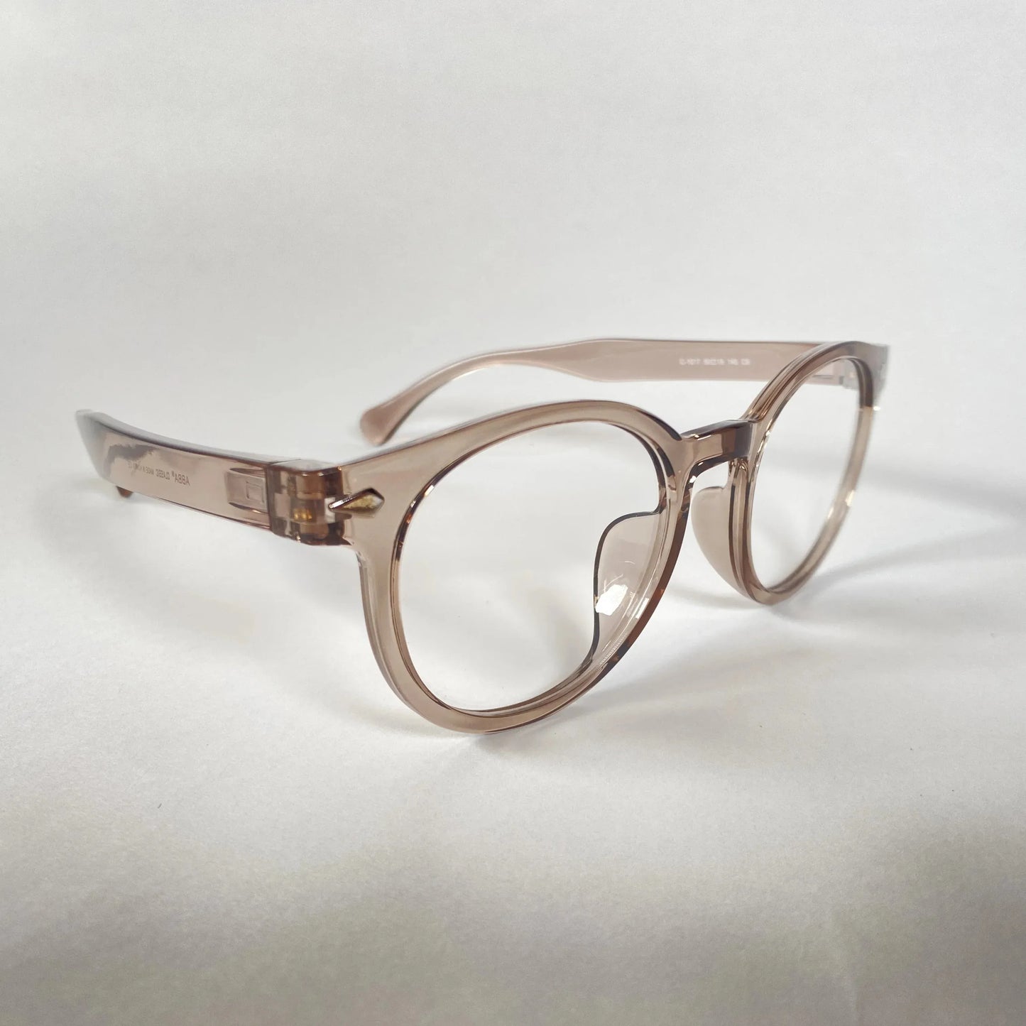 Grey transparent round eyeglasses with thick frames on a plain white background.
