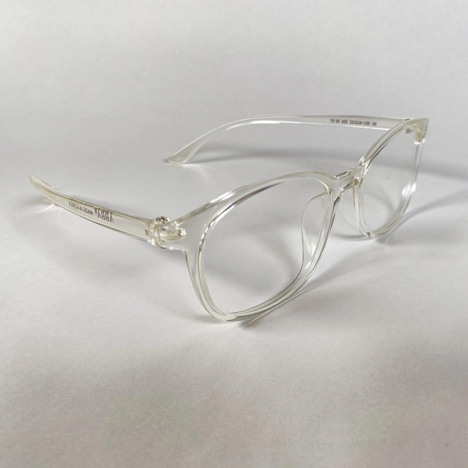 Clear sporty eyeglasses with transparent frames on a white background