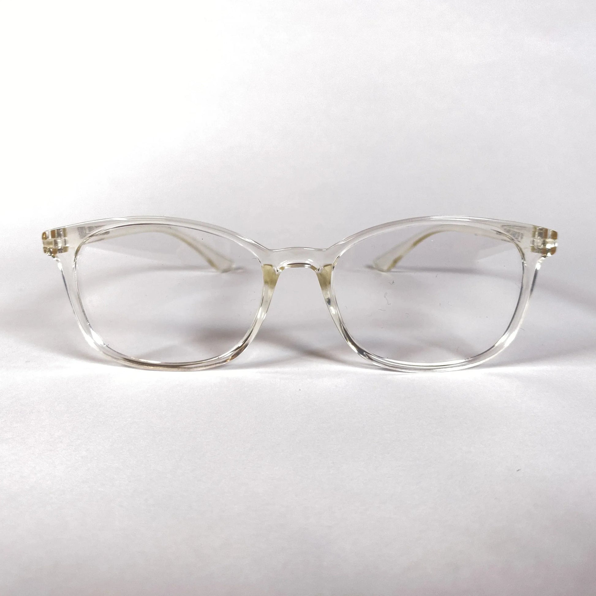 Clear plastic sporty eyeglasses with a round frame on a white background