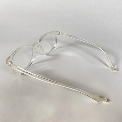 Clear transparent sporty eyeglasses with round frames on white background